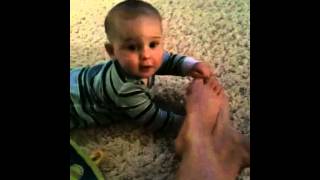 Christian chewing on mommy's toe