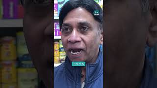 Armed robber trapped in shop by quick-thinking shopkeeper