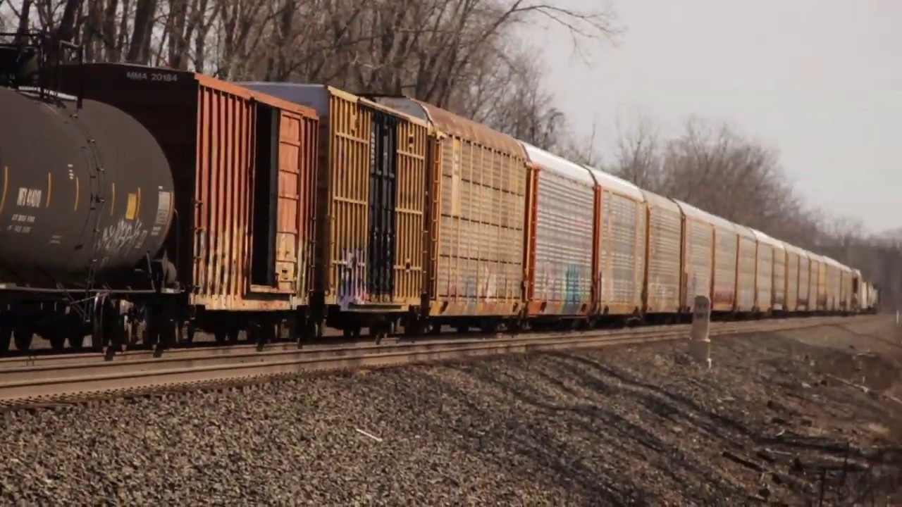 2 CSX general manifest trains passing each other at the same time. ES40DC and CW44AC/H