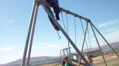 Alex Climbing our swingset. The end is the funniest part. haha.