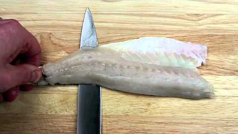 Skinning a fish fillet (sea bass)