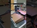 Machine for applying double sided to tape to ecommerce boxes