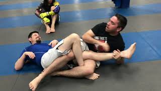 Kneebar trap from top half guard