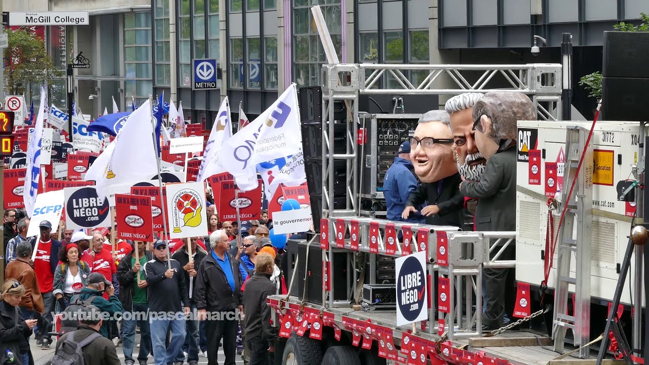 50000 protesters march downtown - 50000 employés publiques manifestent à Montréal policeman or police officer
