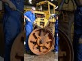 An old abandoned road roller is found in a dusty construction yard.