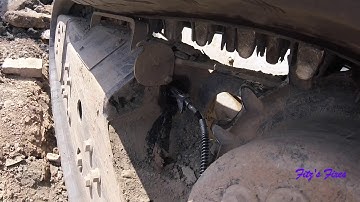 Putting a track back on a skidsteer