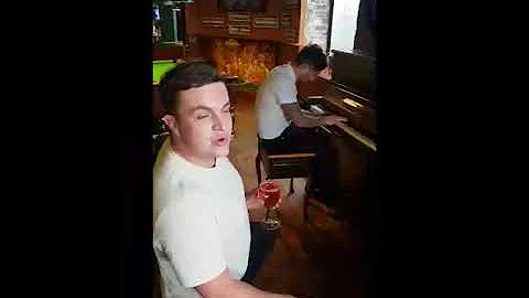 Two lads have a singalong in a pub | CONTENTbible