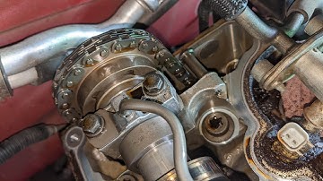 Look inside 2004 Ford Explorer cylinder head, broken timing chain guide on passenger side camshaft