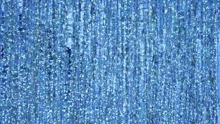 Blue fairy lights creating sparkling bokeh effect for festive holiday backgrounds
