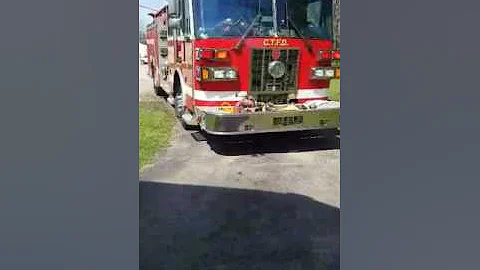 Fireman delivering flowers to an 87 year old woman