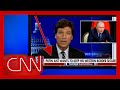 See Russian state TV's reaction to this Tucker Carlson banner