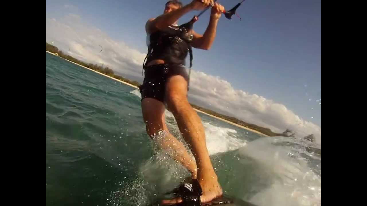 Learning to ride a kitesurf board, nice jump at 