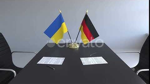 Flags of Ukraine and Germany and Papers on the Table | Motion Graphics - Envato elements