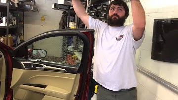 Window Tinting Professional installation using the bottom loading or bomb drop technique