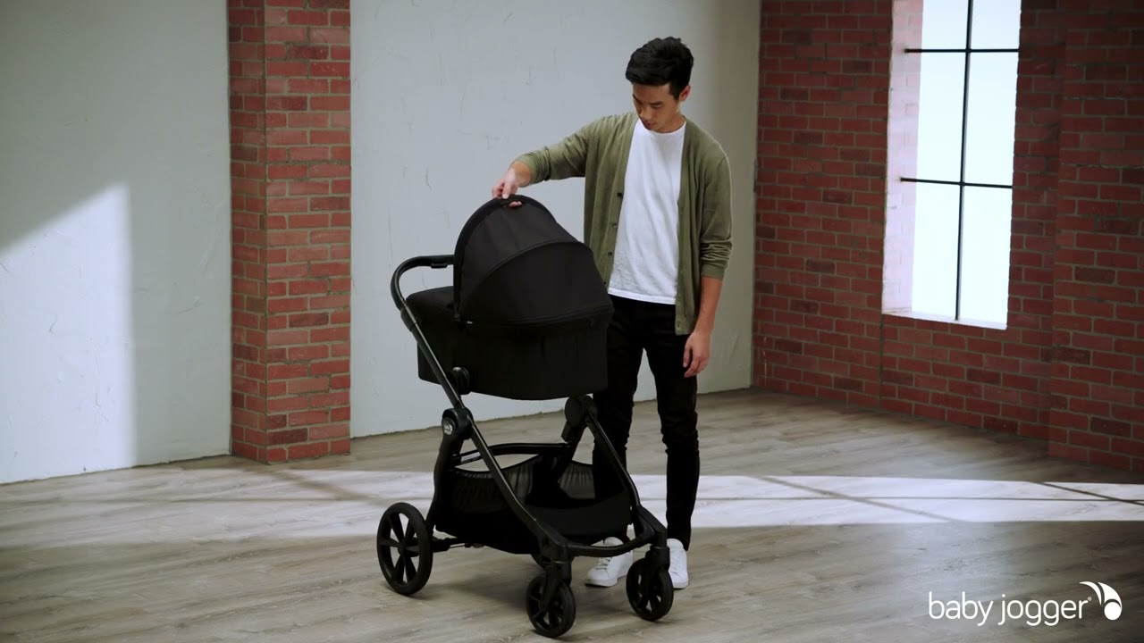 How attach the Deluxe 2 carrycot on the Baby Jogger® select® 2 pushchair - YouTube