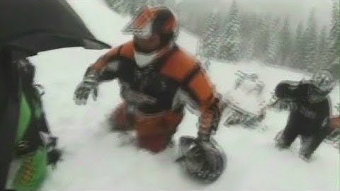 Watch: Avalanche traps snowmobiler