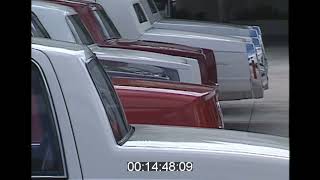 Looking at cars at a Cadillac dealership in 1993