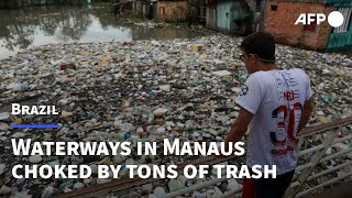 Waterways in Brazil's Manaus choked by tons of trash | AFP screenshot 1