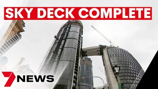 Final piece of Queen's Wharf sky deck lifted into place above Brisbane CBD | 7NEWS