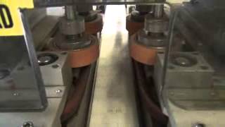 Universal Machine Four Spindle Cap Tightener/Retorquer With Conveyor At Wohl Associates