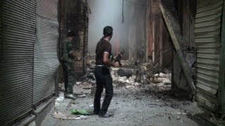 Fierce clashes in Syria as fire engulfs old souk