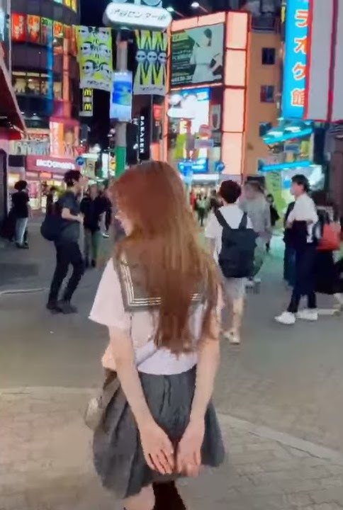 Hot Japanese girl dancing in the street