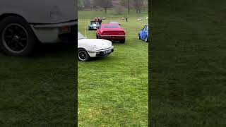 Triumph Herald and Spitfire pull into car show