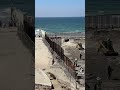 Video shows migrants in Tijuana running through border fencing inside Friendship Park at the border Mp3 Song