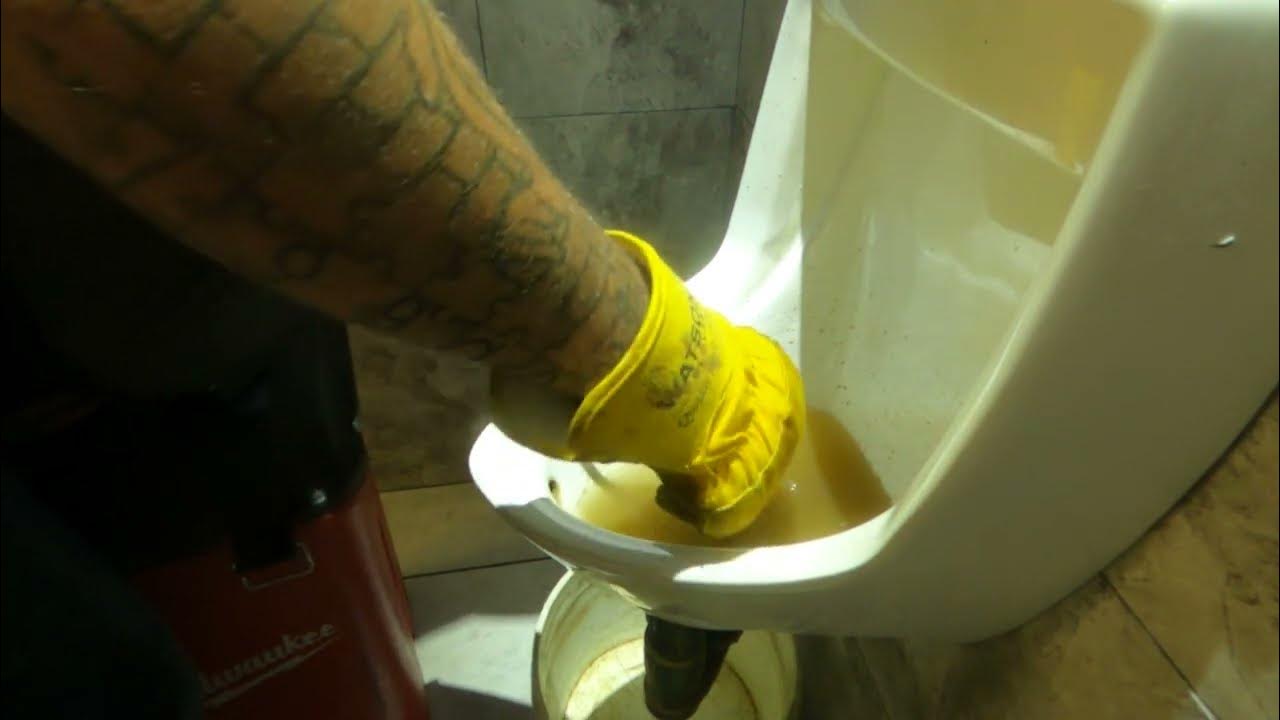 How to unclog a plugged urinal without removing it from the wall. YouTube