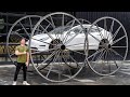 Driving a tesla upsidedown 10ft tall wheels