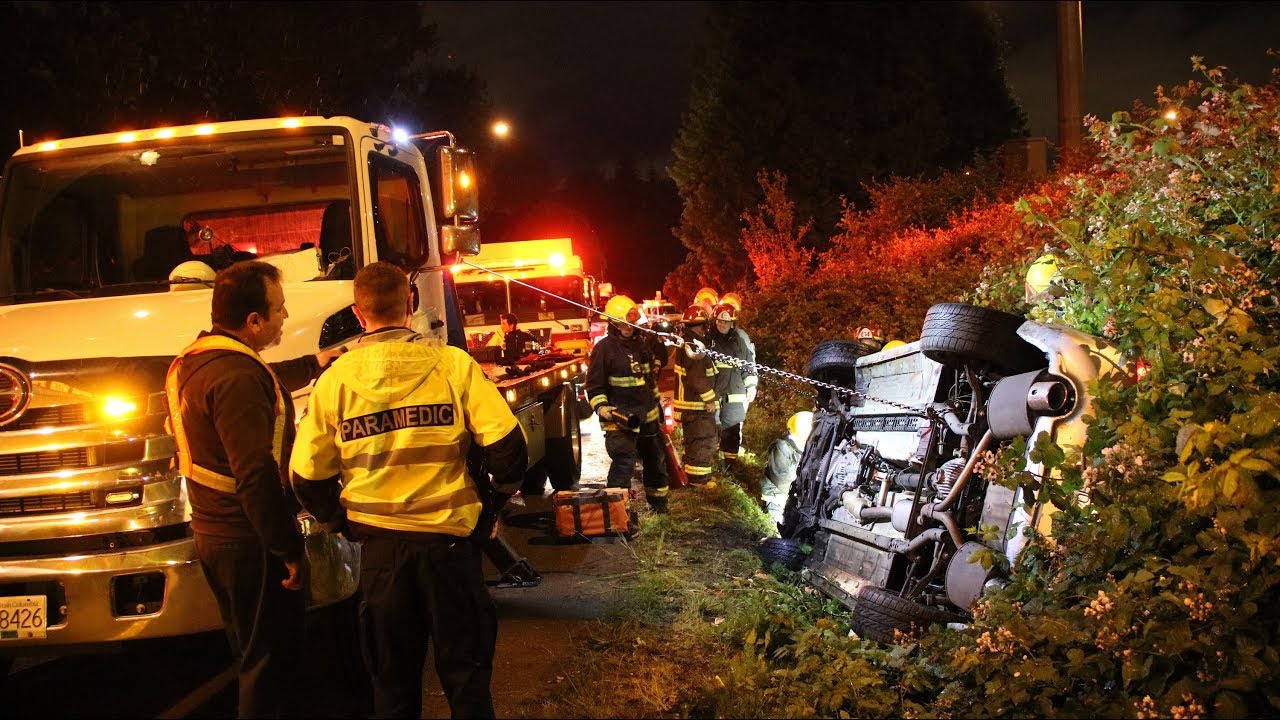Tow Truck Driver Helps Rescue Two People After Crash - YouTube