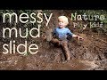 Sliding down a mud slide into a messy muddy puddle