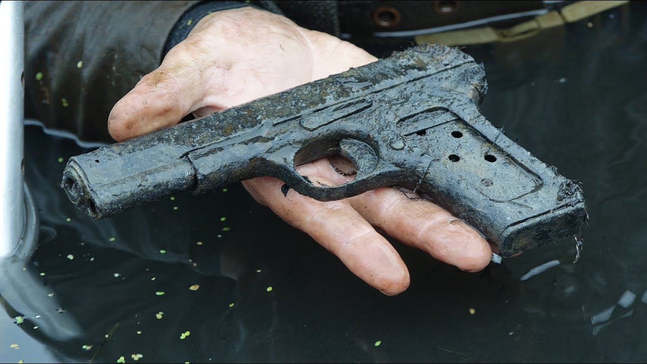 A submachine gun in the hands of a deceased soldier Excavations of