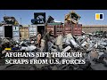 Afghans sift through US military junkyard for scraps to sell