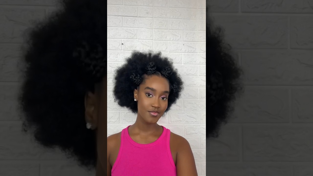 Styling a grill head Afro kinky wig. Call or WhatsApp +256787809774 to place your order