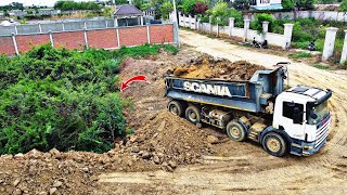 Powerful Komatsu D58E Bulldozer Pushes soils and fill in forests with 25ton dump truck pouring soils