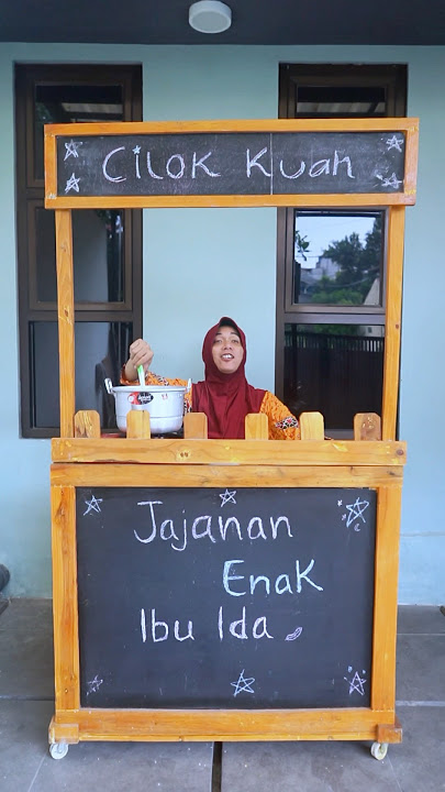 Little boy eats cilok soup