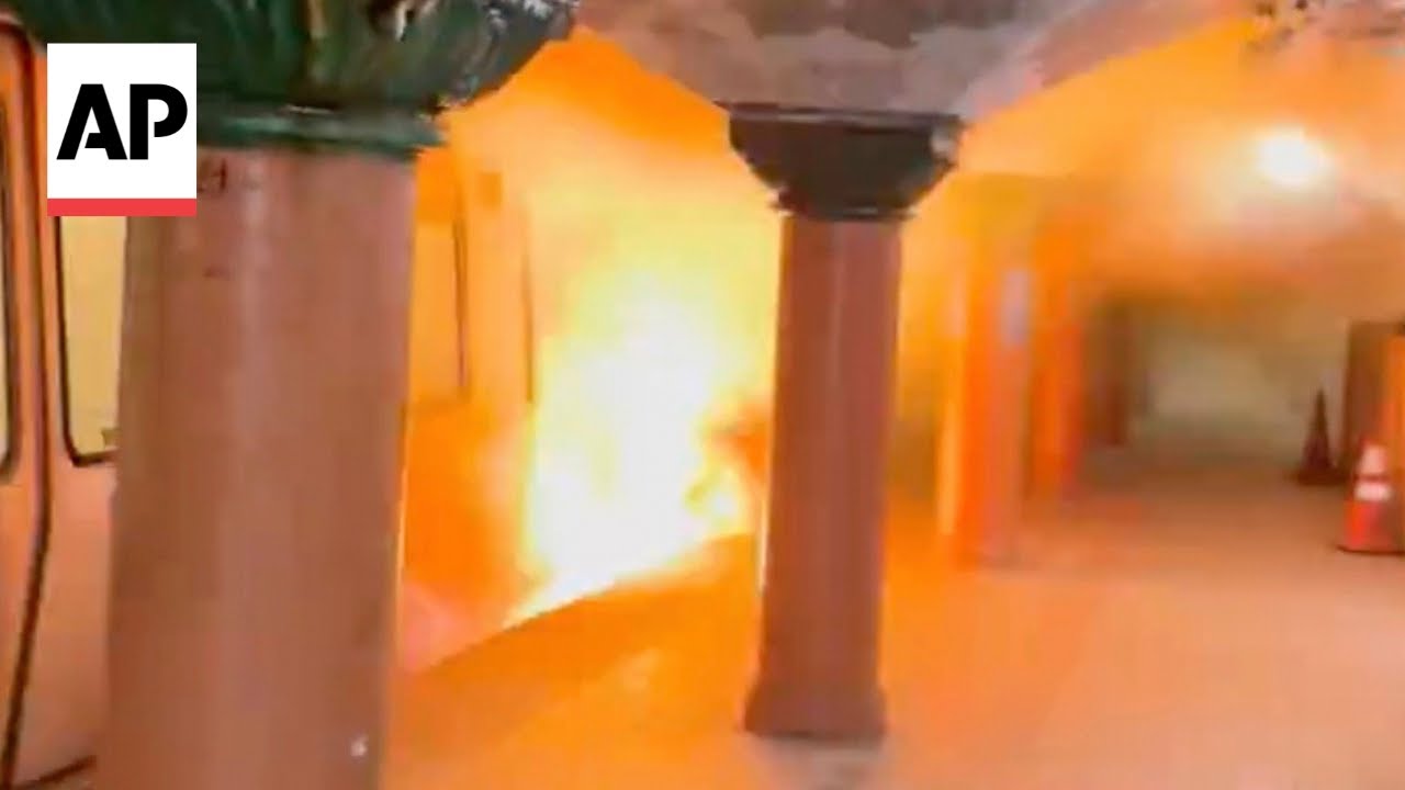 Passengers evacuate New York City area train as flames erupt - YouTube