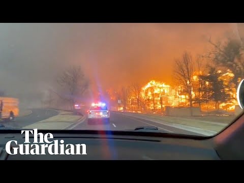 Wildfires sweep through Colorado destroying homes as tens of thousands evacuate