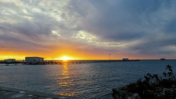 Island Time-Lapse: Clouds, Sunset, and Moonset Over the Ocean