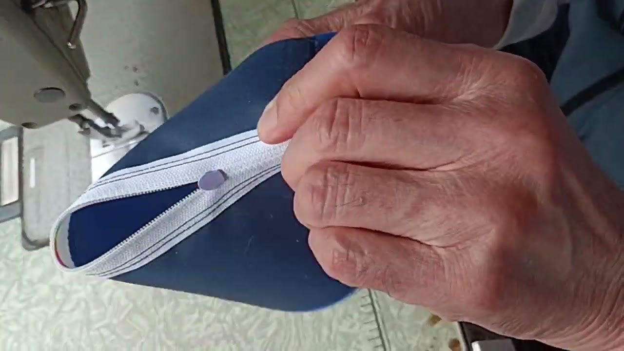 How about sewing a button onto the wallet of the sewing machine