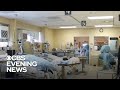 Hospitals overwhelmed as U.S. sees record new coronavirus cases