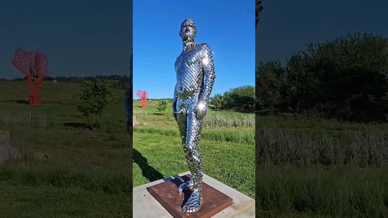 Man with multiple mirrors by Jason Kimes 