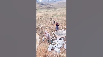 Look at this assembly line method for transporting bricks!