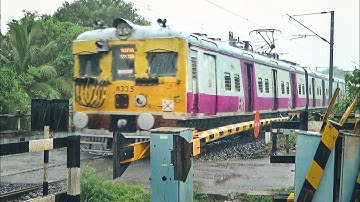 Back to Back Old 🚈 EMU local trains passing a level crossing in heavy rainfall