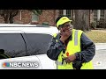 Elementary school 'carpool dads' surprise crossing guard with new car