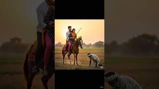 Couple ride on horse in wheat farm