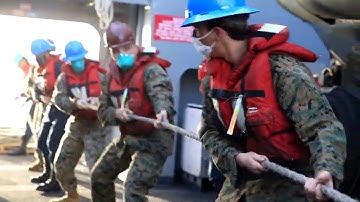 ALL Hands on Deck - Sailors and Marines Conduct a Replenishment at Sea