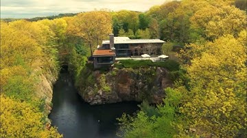 "Exploring the Enigmatic Mansion perched above an Abandoned Quarry"