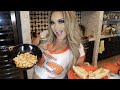 cooking Steph Pappas' pasta vodka sauce shells + garlic bread